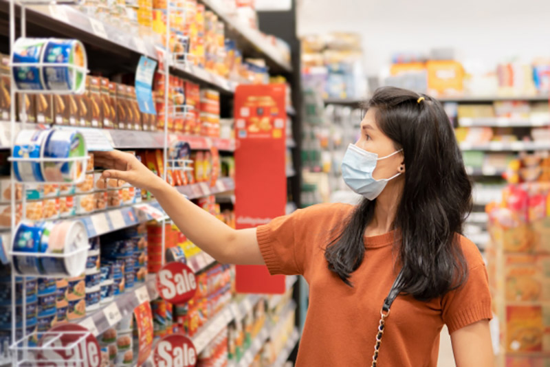 A woman shops for groceries at a supermarket