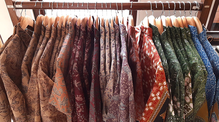 Batik shirts hanging on a rack